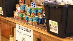 Stacked non-perishible food on a table for the Larimer County food bank