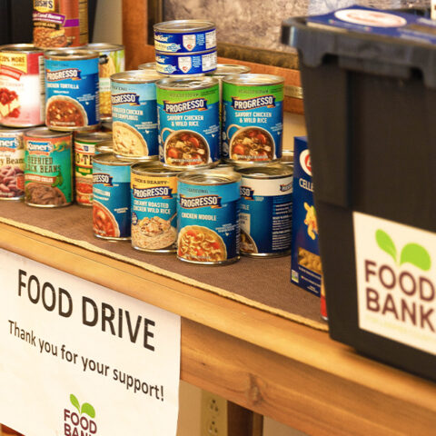 Stacked non-perishible food on a table for the Larimer County food bank