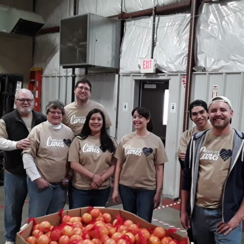 Points West Bank bundles grapefruits for food bank