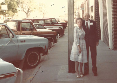 Harold Olsen and his wife standing outside