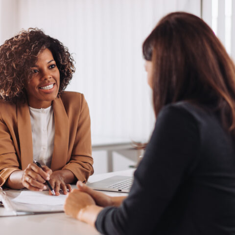Woman consulting with a female financial manager at the bank